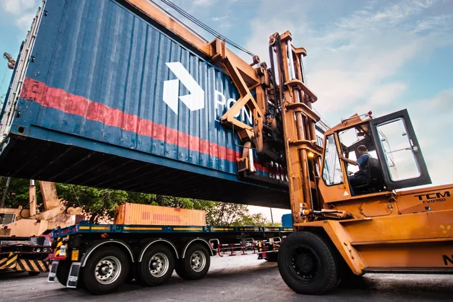 Forklift handling a Pongsiri shipping container