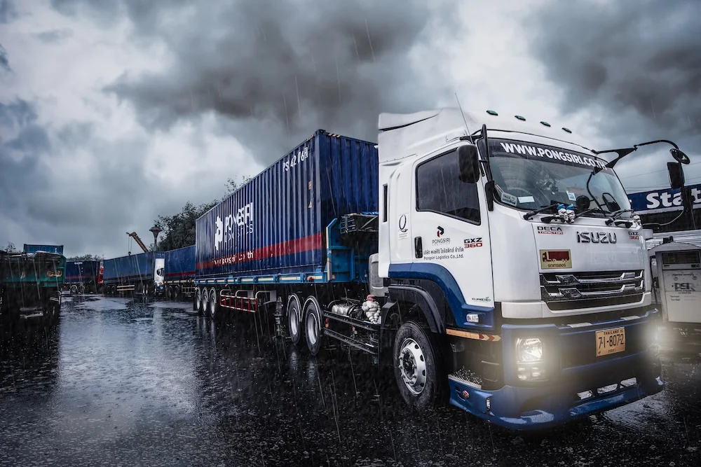 Pongsiri Logistics container truck at the transport yard at dusk