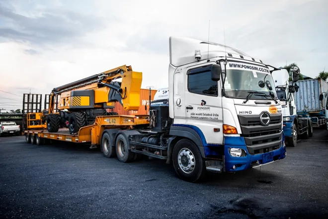 Heavy machinery loaded on a lowbed trailer