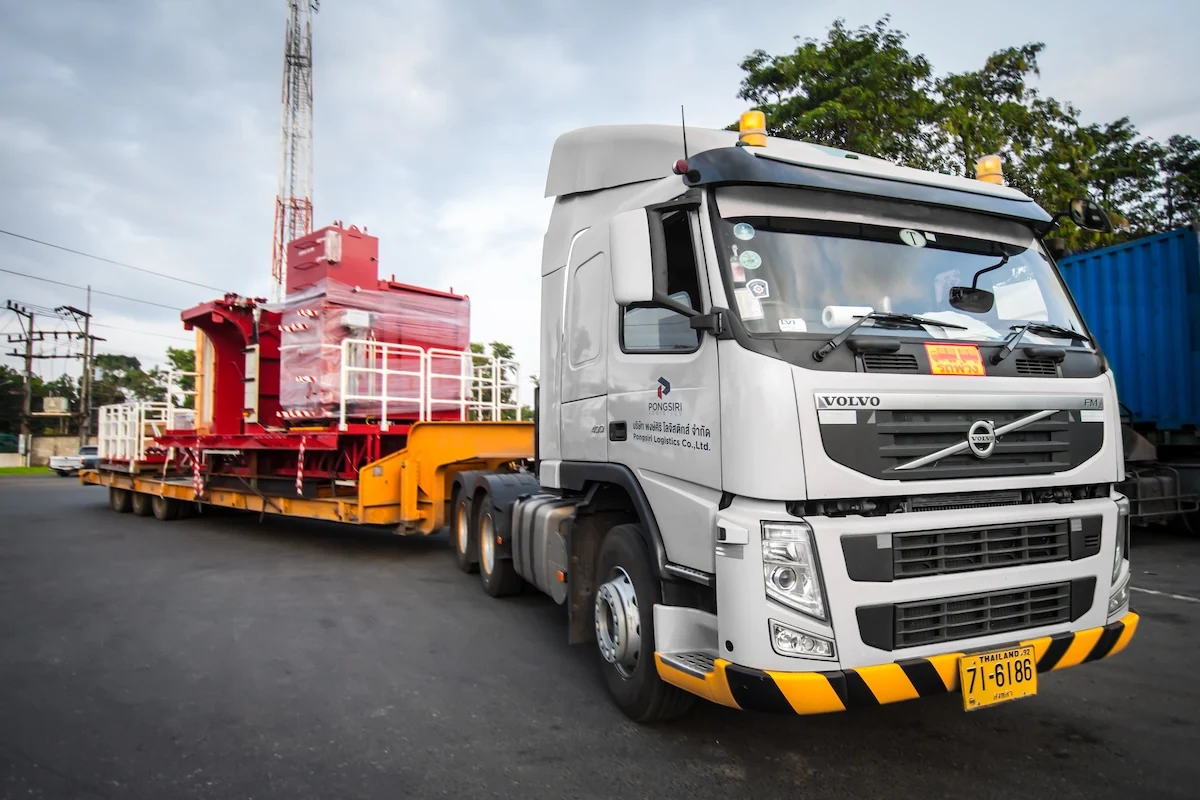 Pongsiri tractor and trailer carrying industrial equipment