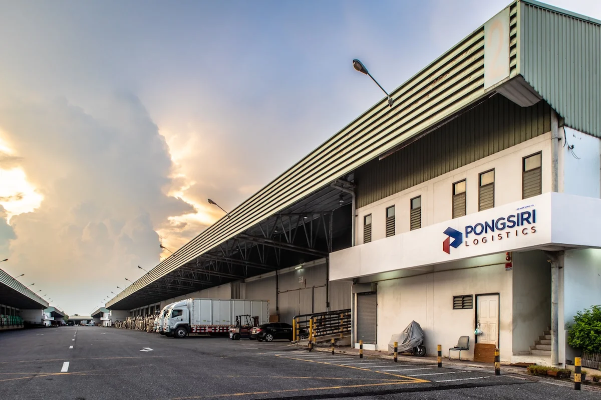 Pongsiri Logistics warehouse exterior and loading bays at sunset